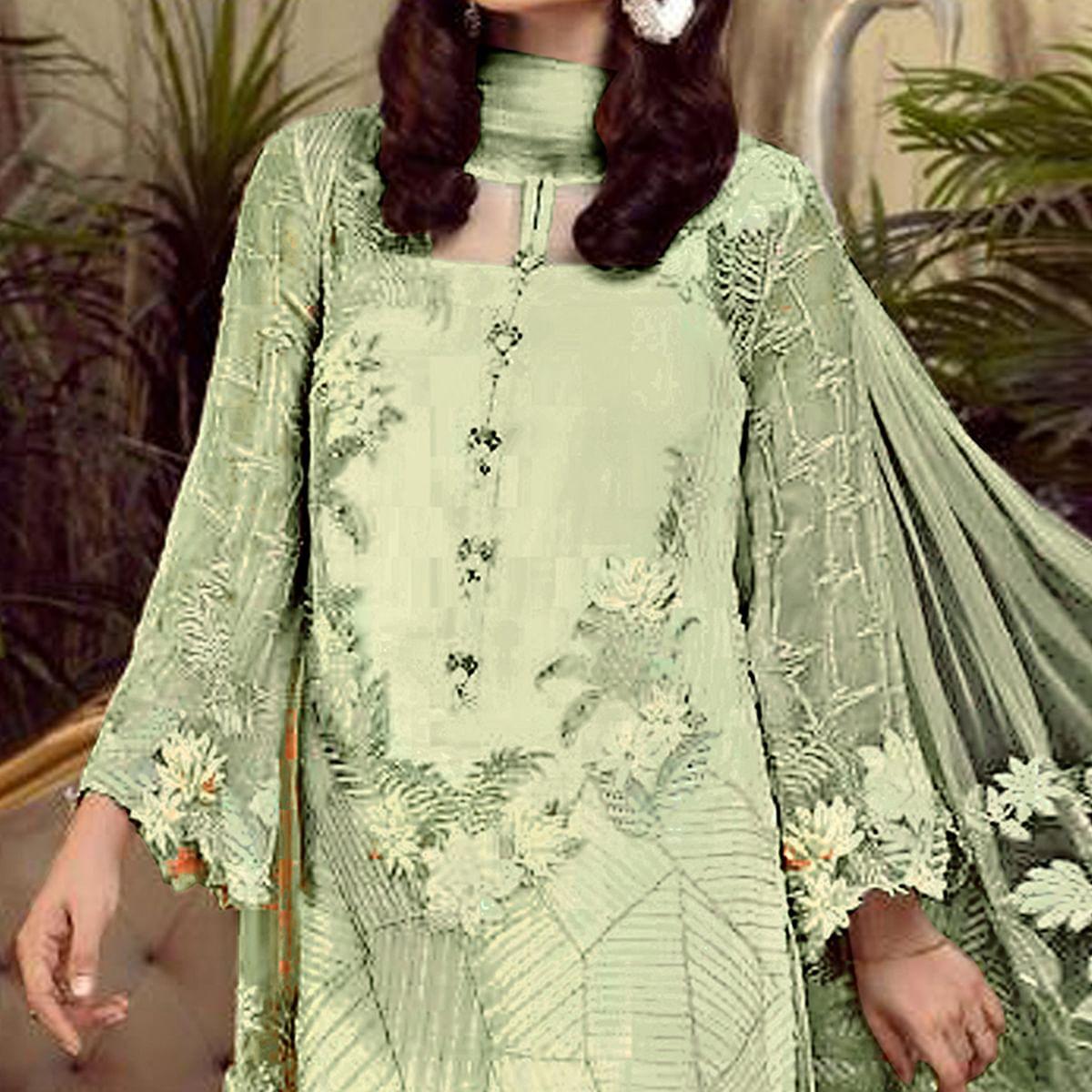Charming Green Colored Partywear Embroidered Faux Gerogette Straight Suit