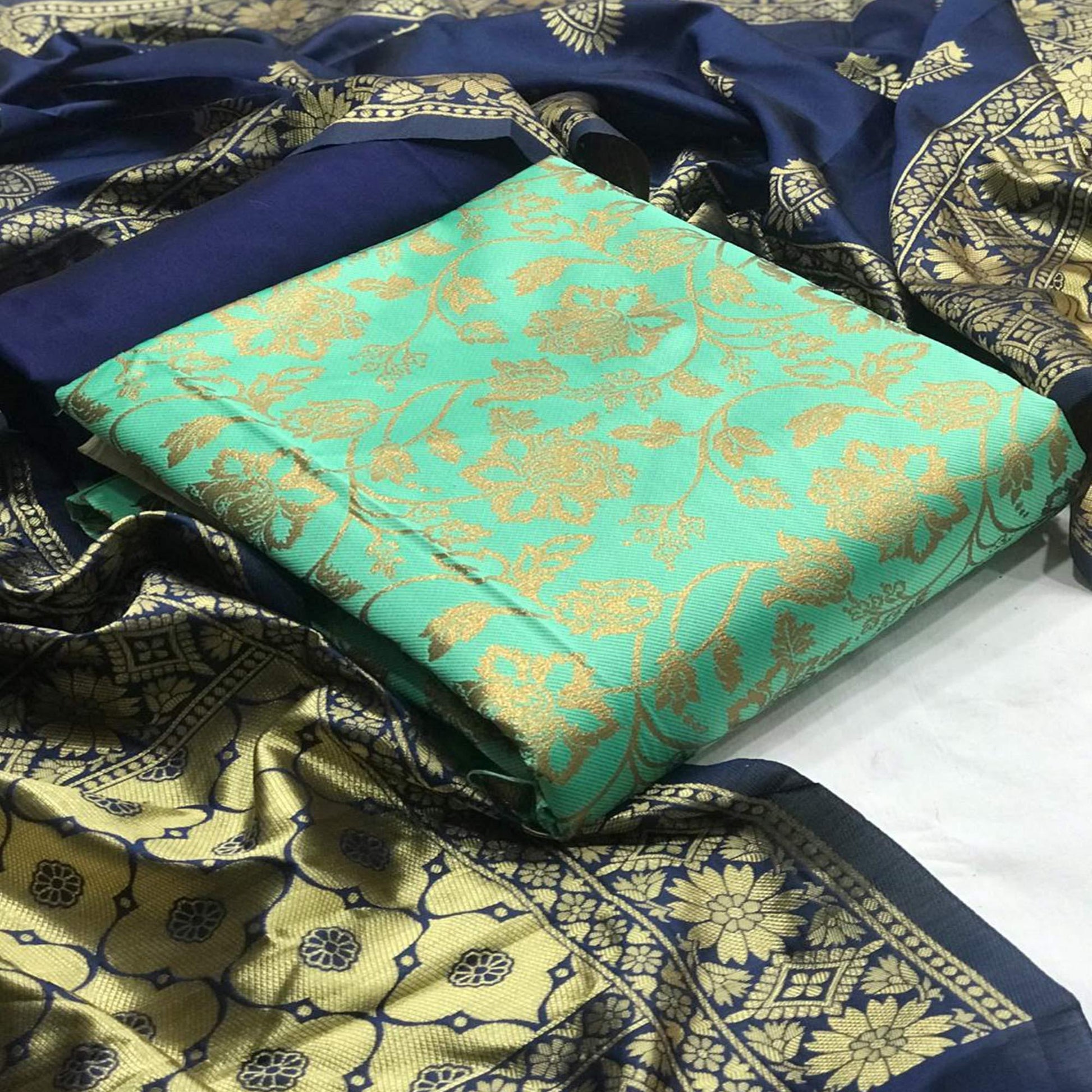 Charming Sea Green Colored Casual Wear Woven Banarasi Silk Dress Material