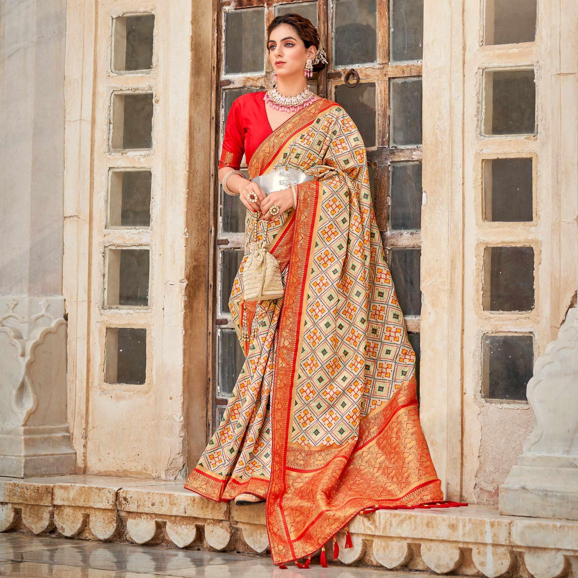 Chikoo Woven Art Silk Patola Saree With Tassels
