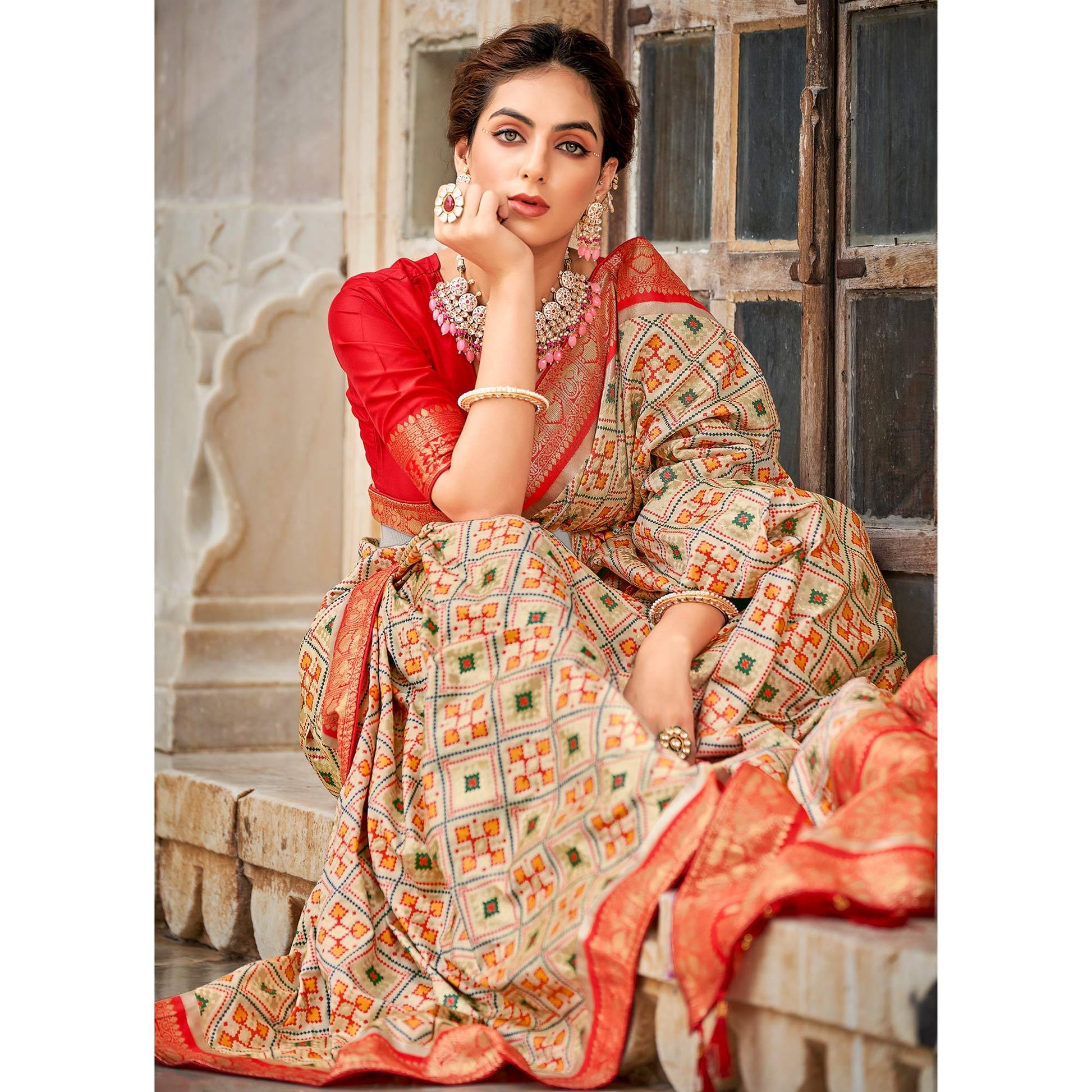 Chikoo Woven Art Silk Patola Saree With Tassels