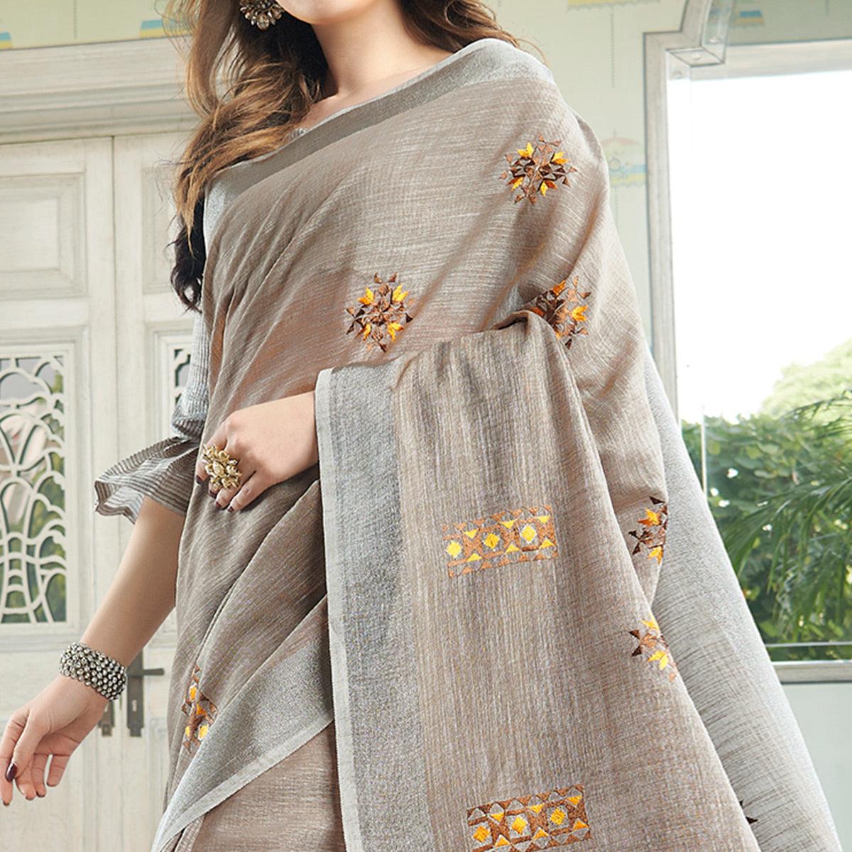 Classy Pastel Brown Colored Casual Wear Floral Embroidered Linen-Cotton Saree With Tassels