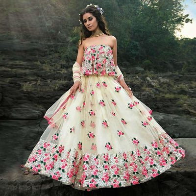 Cream Partywear Sequins Embroidered Soft Net Lehenga Choli
