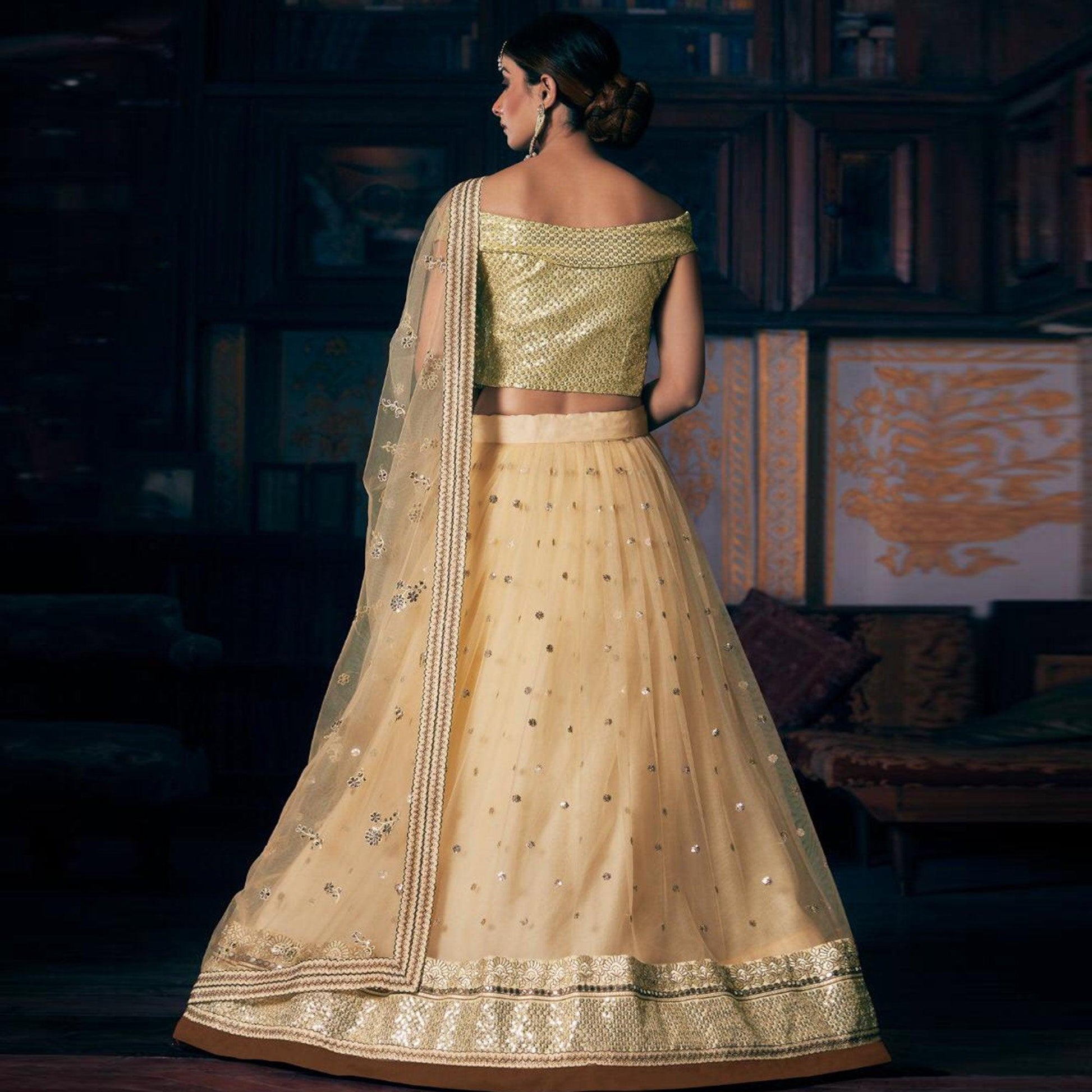 Cream Wedding Wear Floral Embroidery With Sequins And Dori Work Net Lehenga Choli