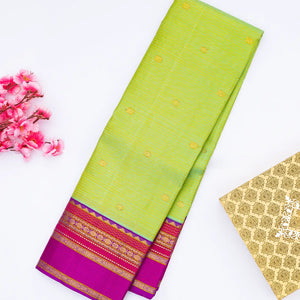 Cardamom Green Handloom Kanchipuram Korvai Silk Saree With Zari Stripes & Buttas