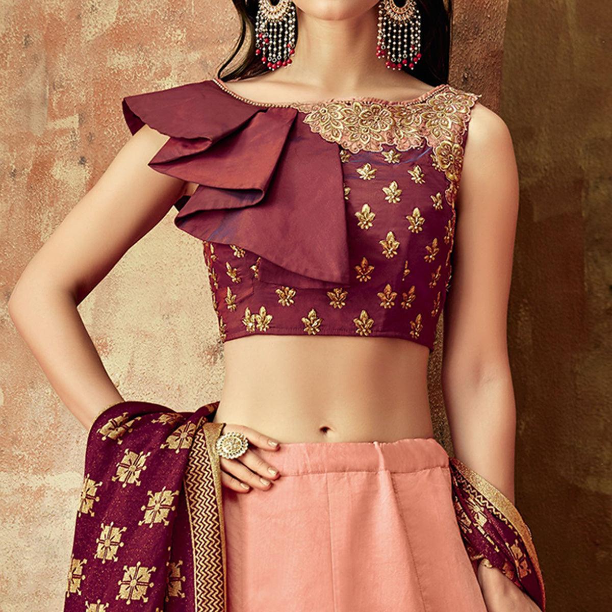 Dazzling Peach Colored Partywear Embroidered Silk Lehenga Choli