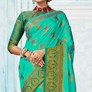 Dazzling Turquoise Green Colored Festive Wear Woven Nylon Silk Saree