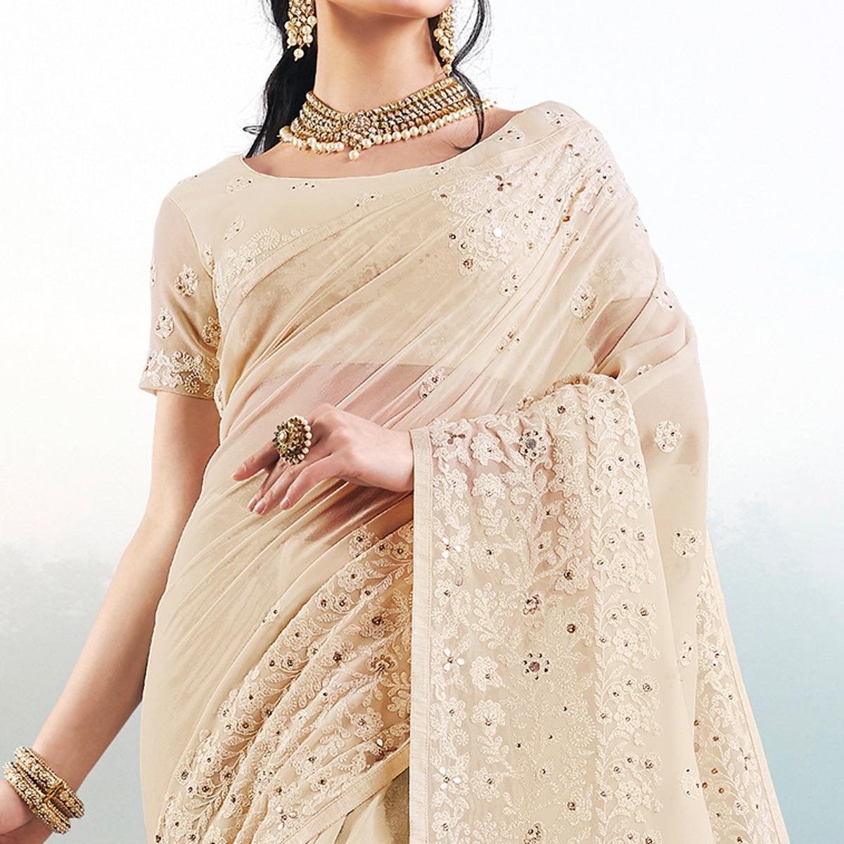 Demanding Beige Colored Partywear Embroidered Georgette Saree