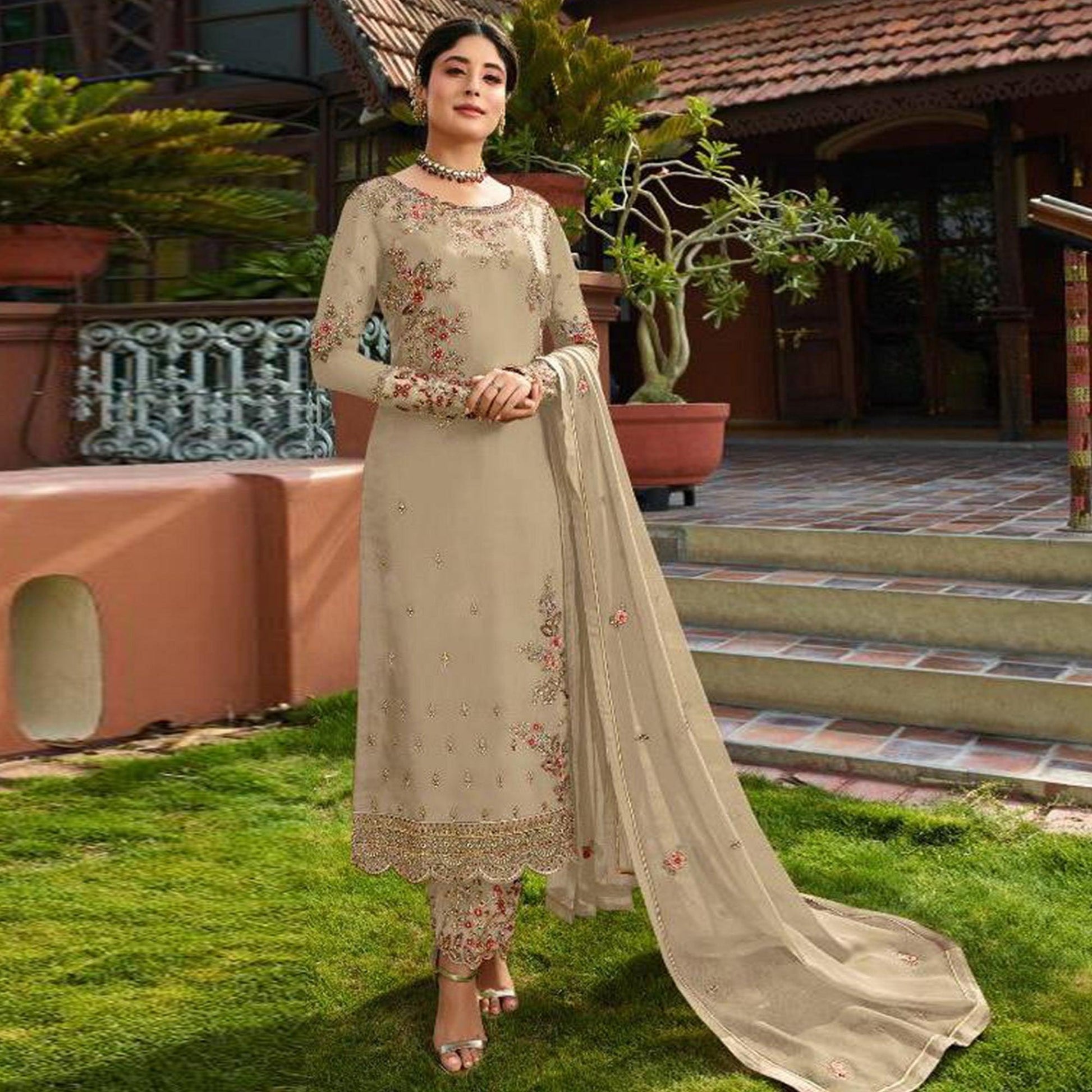 Demanding Beige Colored Partywear Embroidered Gerorgette Straight Suit