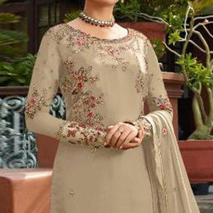 Demanding Beige Colored Partywear Embroidered Gerorgette Straight Suit