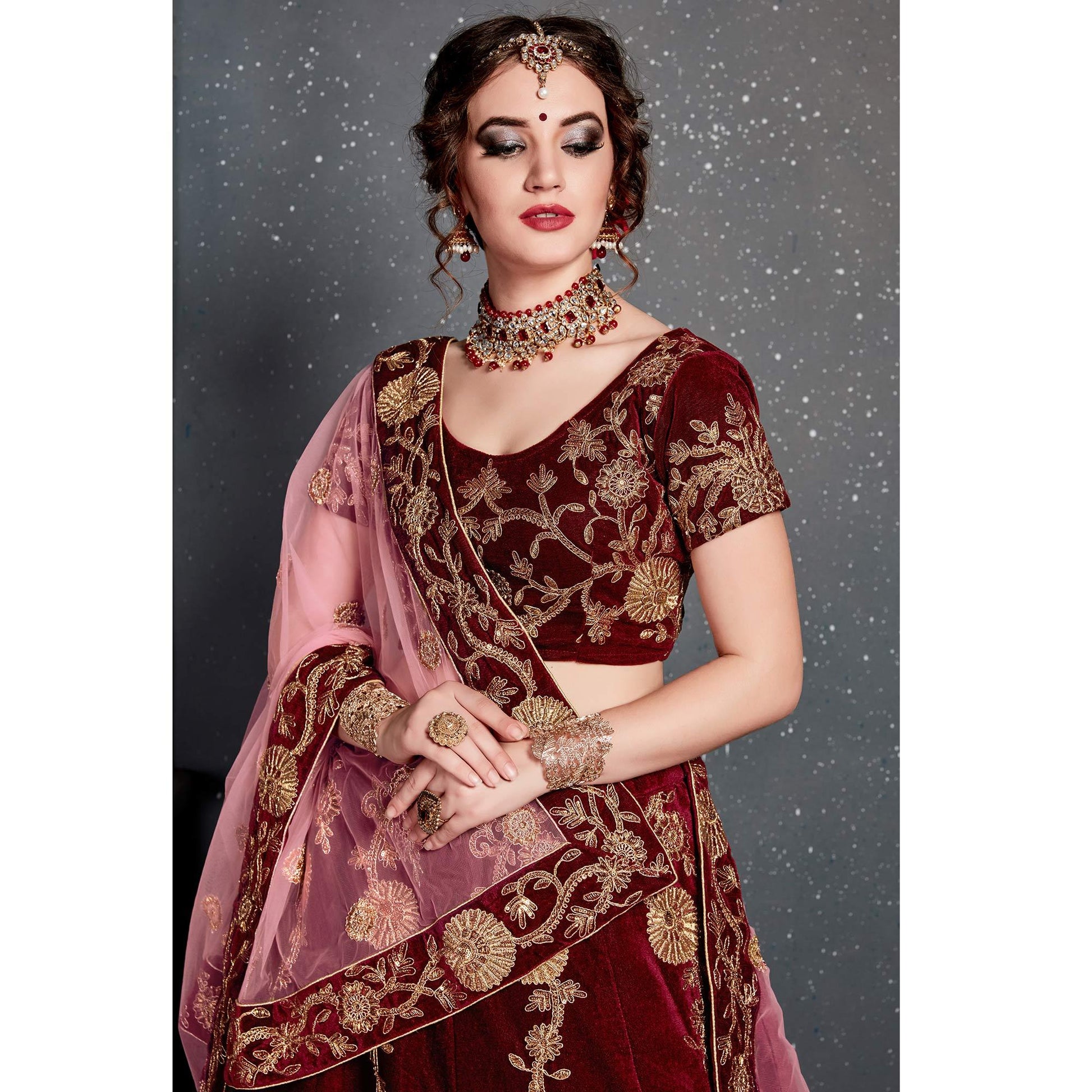 Demanding Maroon Colored Partywear Designer Embroidered Velvet Lehenga Choli
