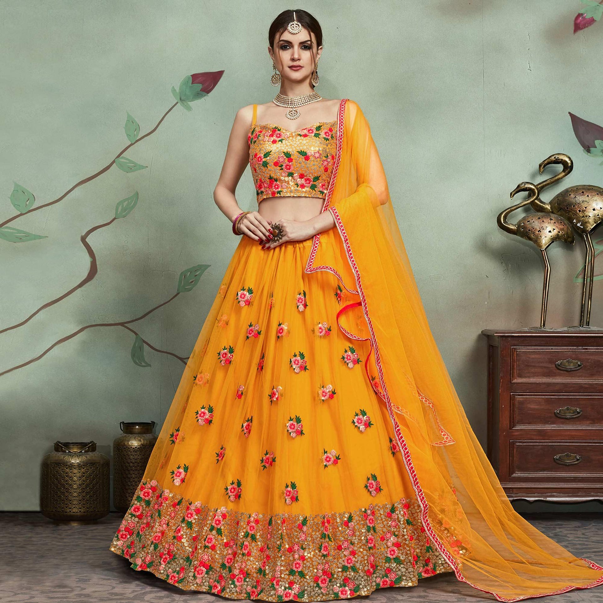 Demanding Mustard Yellow Colored Partywear Embroidered Netted Lehenga