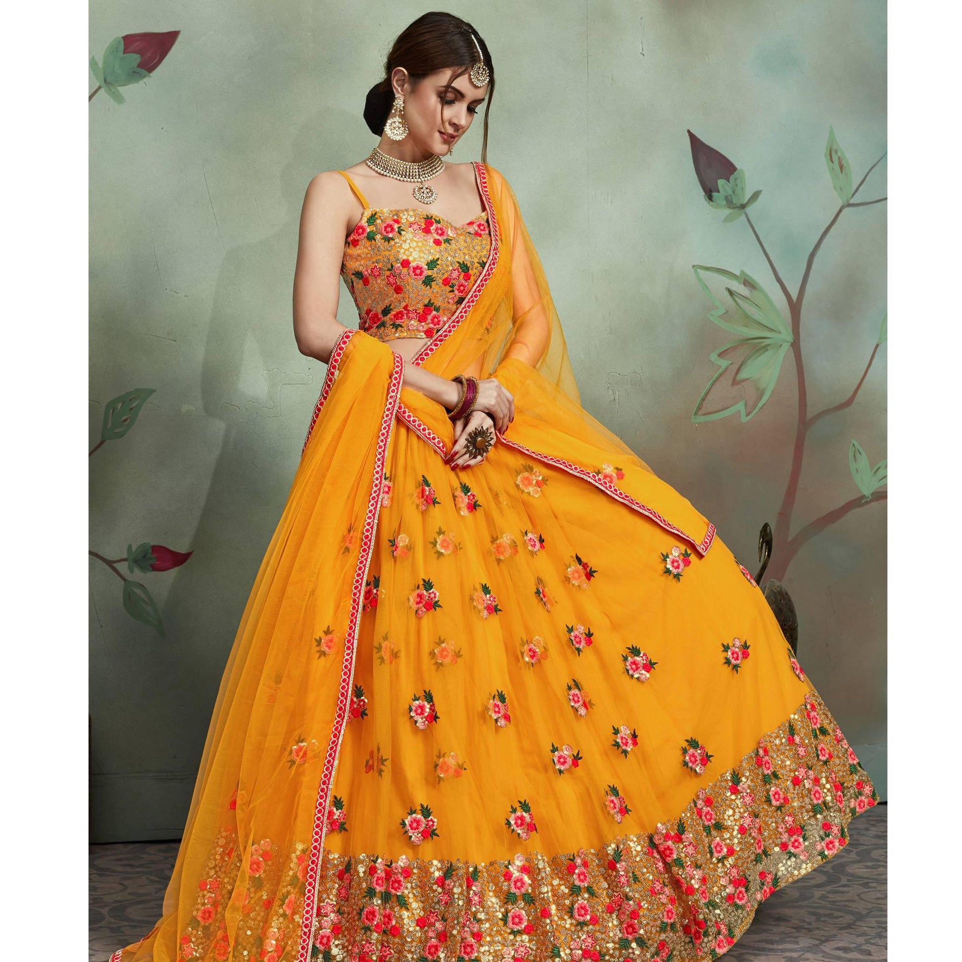 Demanding Mustard Yellow Colored Partywear Embroidered Netted Lehenga
