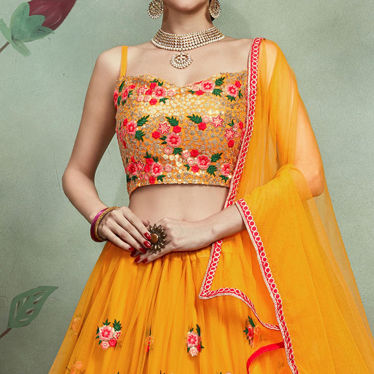 Demanding Mustard Yellow Colored Partywear Embroidered Netted Lehenga