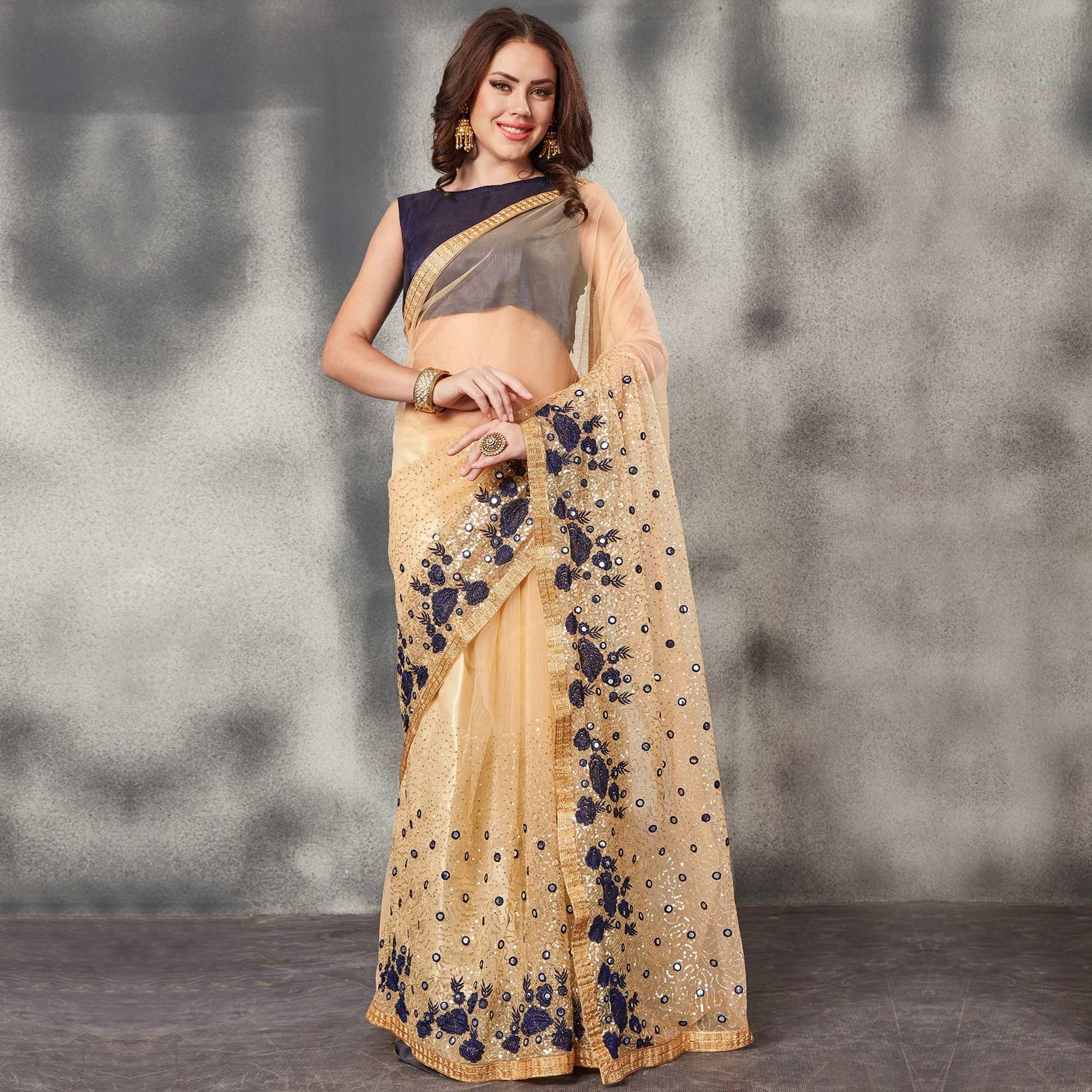 Desirable Beige Navy Blue Colored Partywear Embroidered Netted Saree