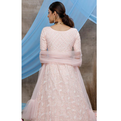 Desirable Pastel Peach Colored Party Wear Embroidered Net Lehenga Choli