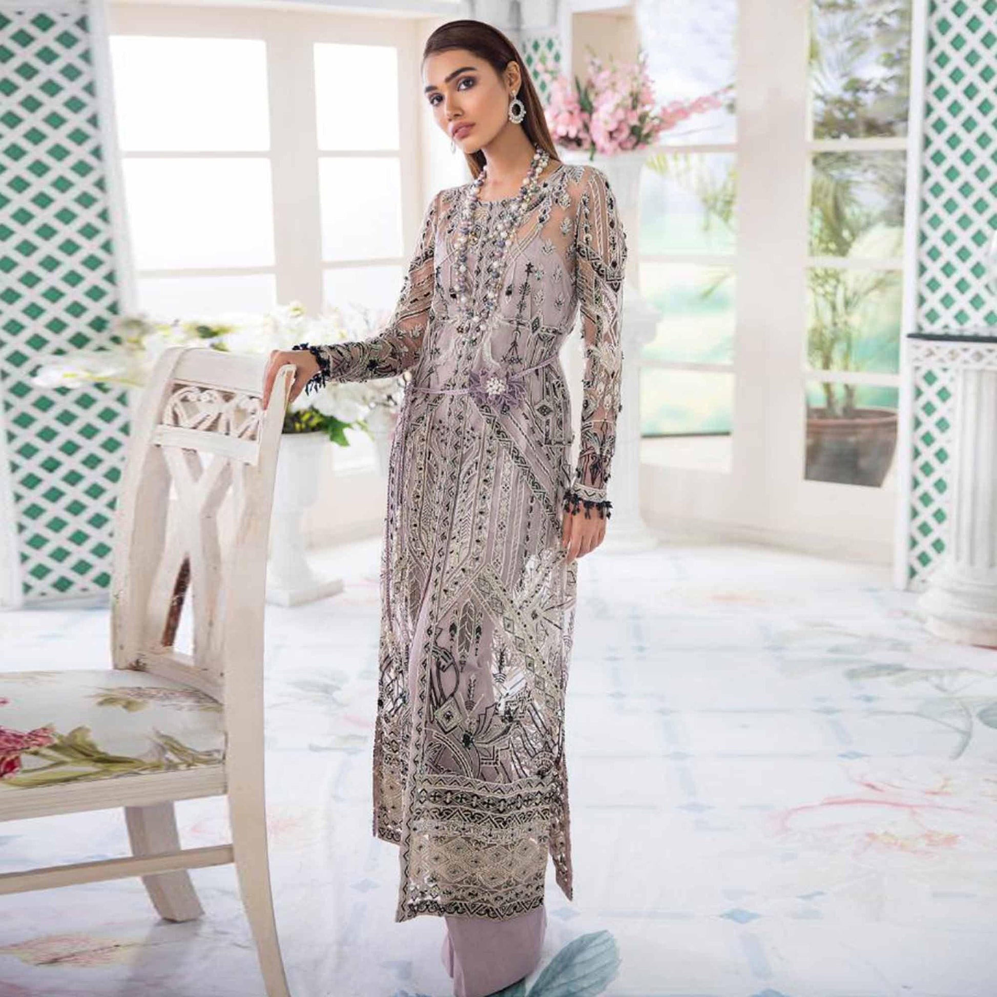 Desirable Pastel Purple Colored Party Wear Embroidered Net Palazzo Suit