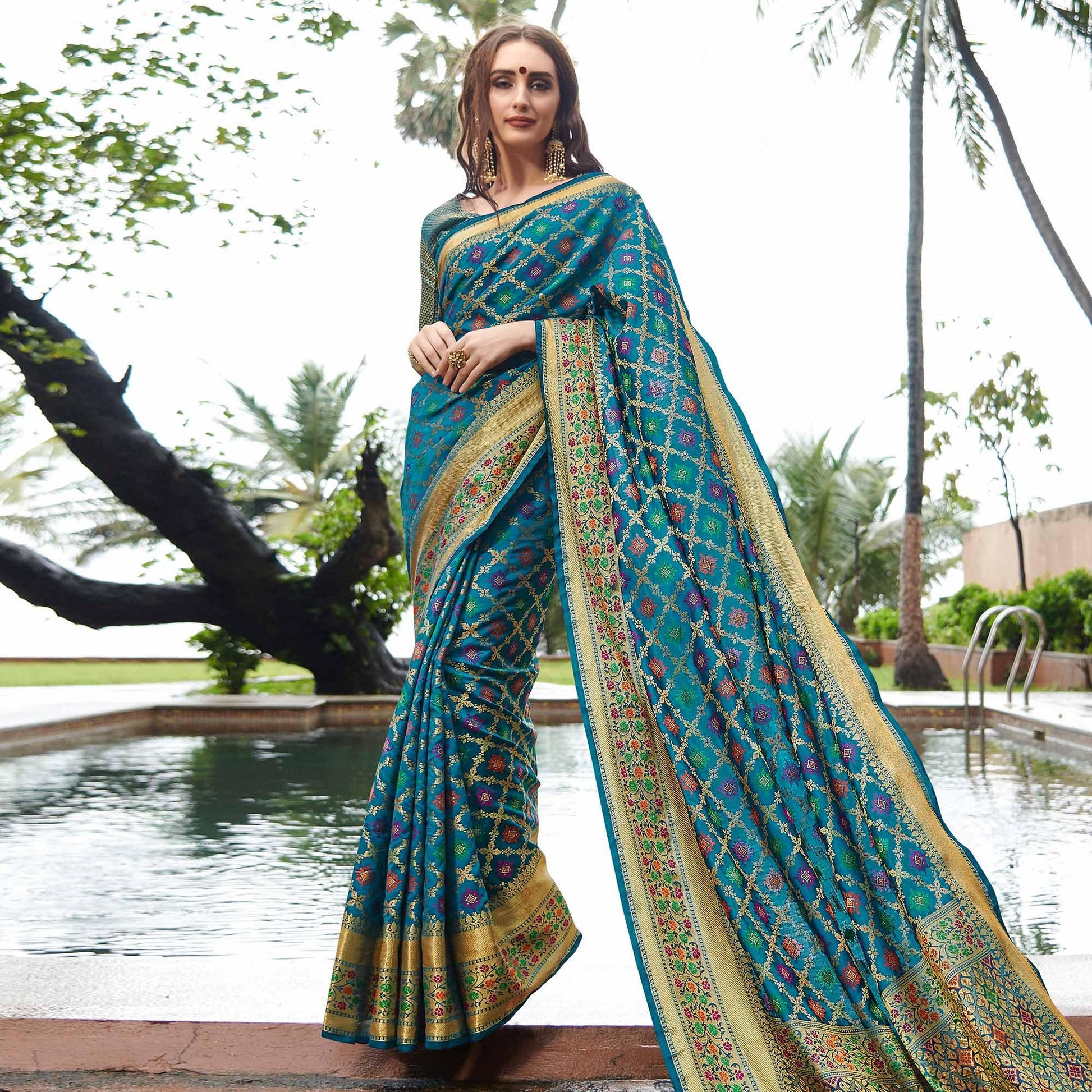 Desirable Turquoise Blue Colored Festive Wear Woven Silk Saree