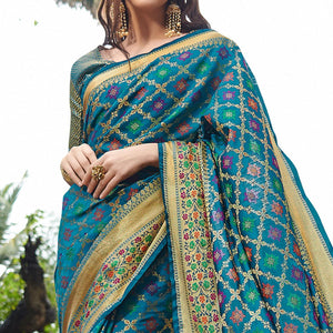 Desirable Turquoise Blue Colored Festive Wear Woven Silk Saree