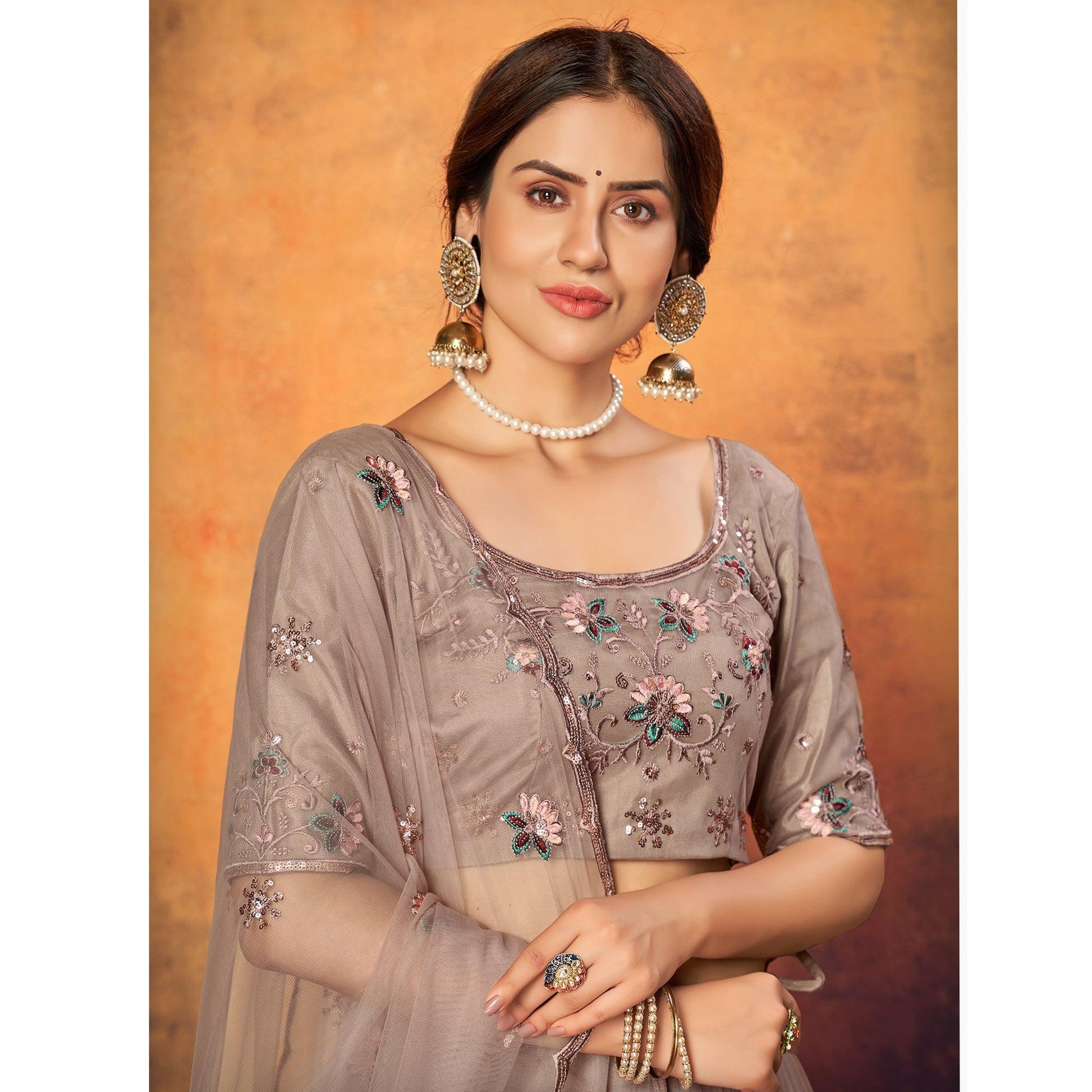 Dusty Brown Festive Wear Thread With Floral Sequins Embroidered Net Lehenga Choli
