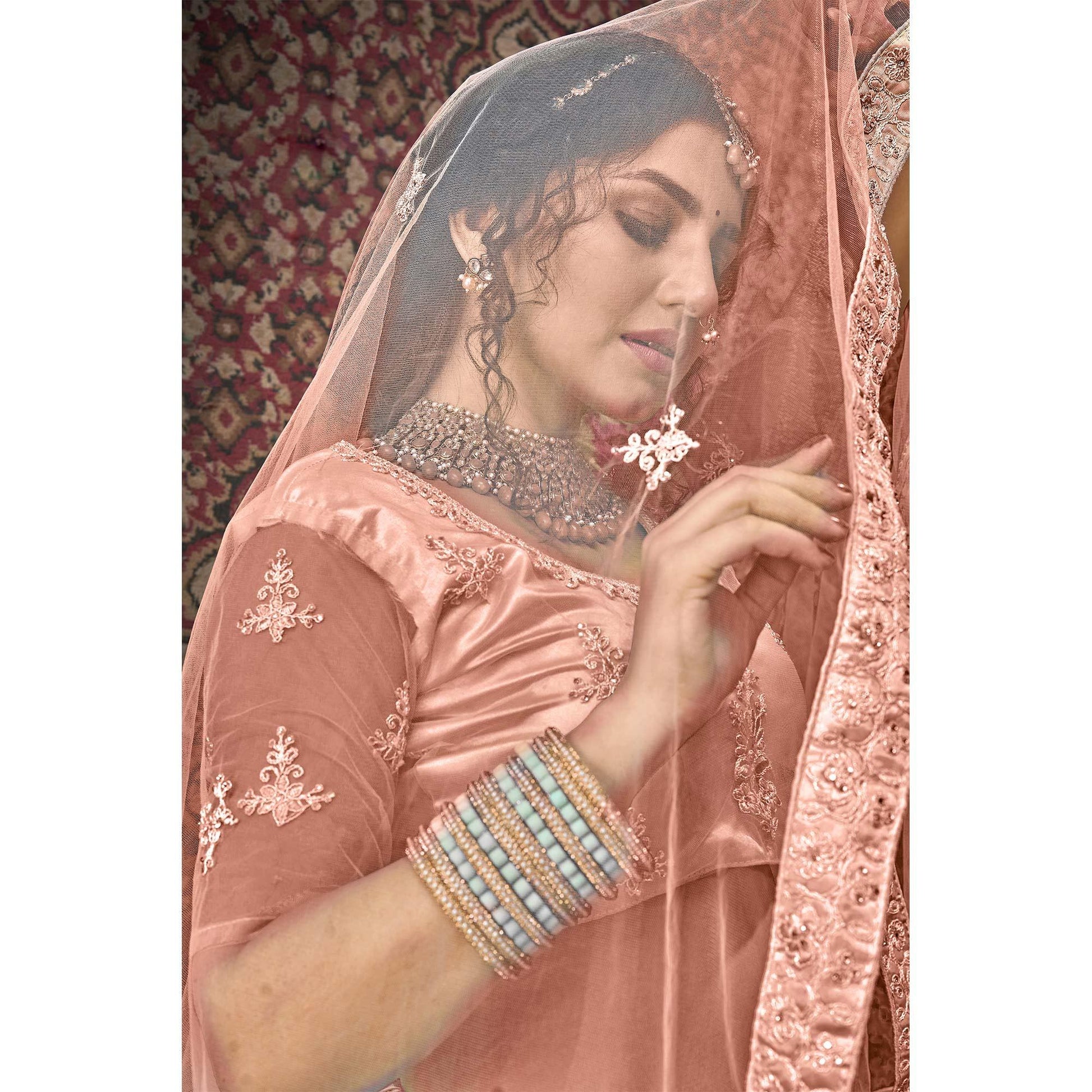 Dusty Pink Partywear Multi Sequins Embroidered Net Lehenga Choli