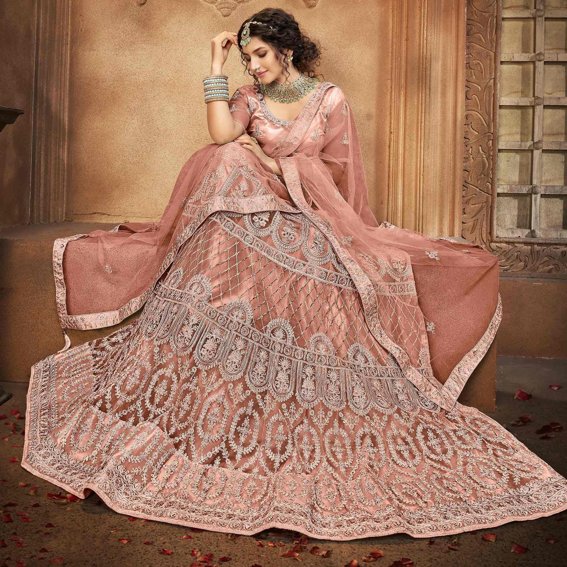 Dusty Pink Partywear Multi Sequins Embroidered Net Lehenga Choli