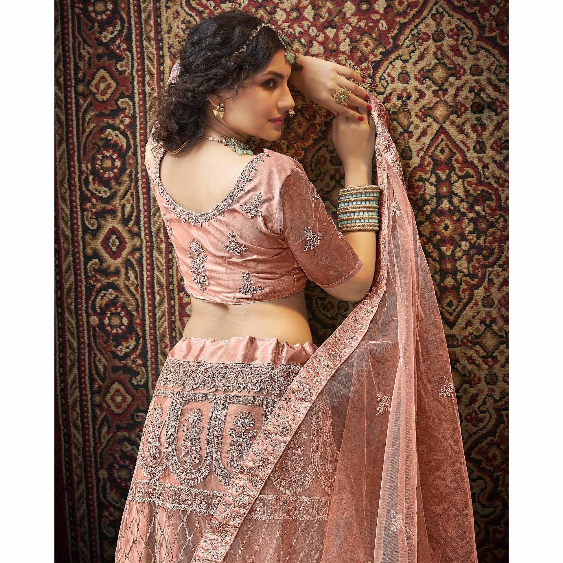 Dusty Pink Partywear Multi Sequins Embroidered Net Lehenga Choli