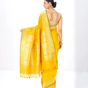 Mustard Handwoven Banarasi Silk Saree With Floral Motifs & Corner Buttas
