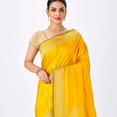 Mustard Handwoven Banarasi Silk Saree With Floral Motifs & Corner Buttas