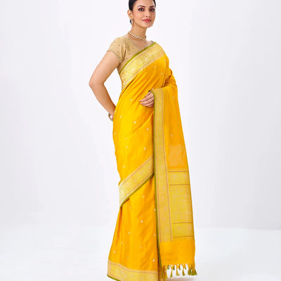 Mustard Handwoven Banarasi Silk Saree With Floral Motifs & Corner Buttas