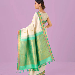 Cream Handloom Kanchipuram Silk Saree With Zari Buttas & Contrast Border