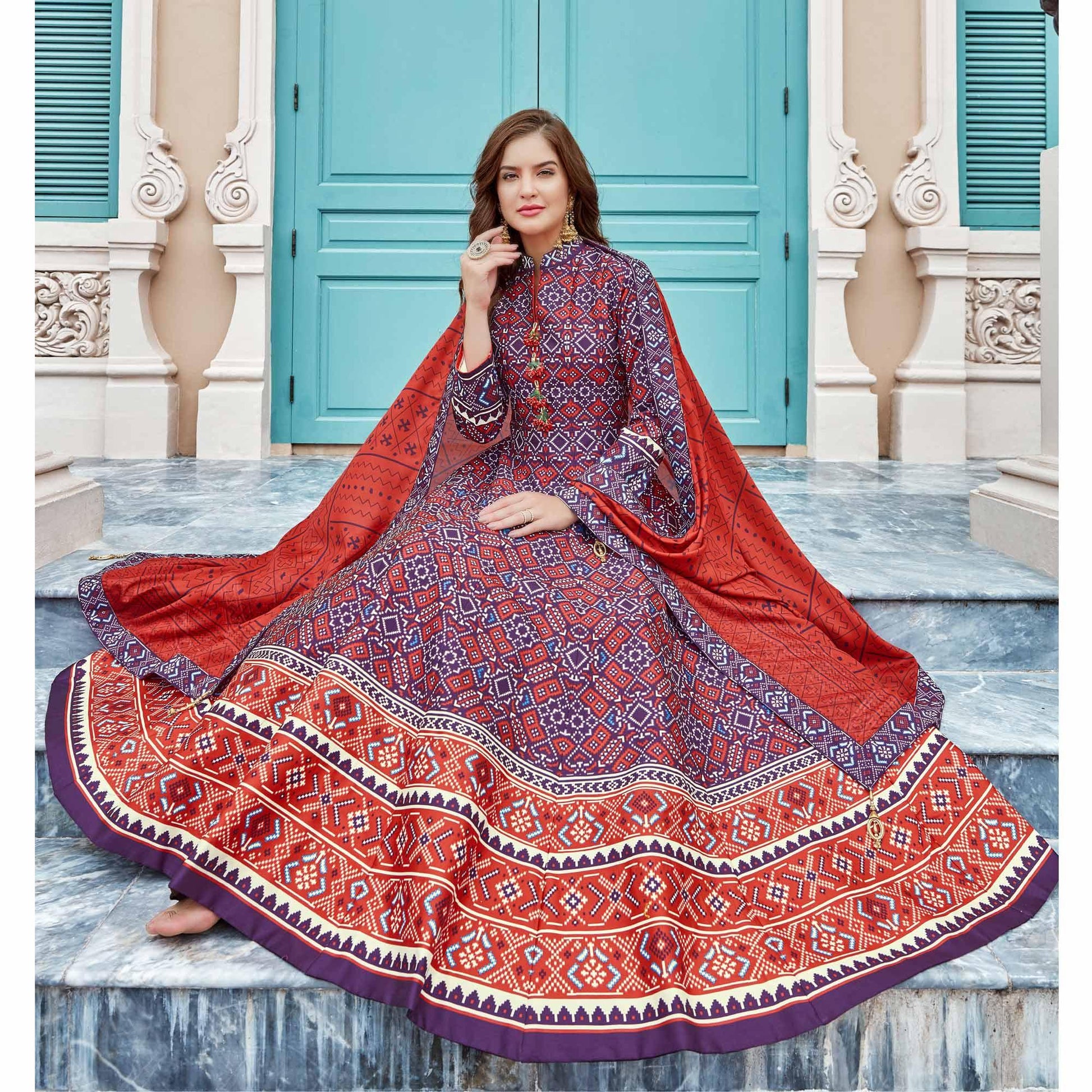 Elegant Blue Colored Partywear Patola Printed Silk Anarkali Suit