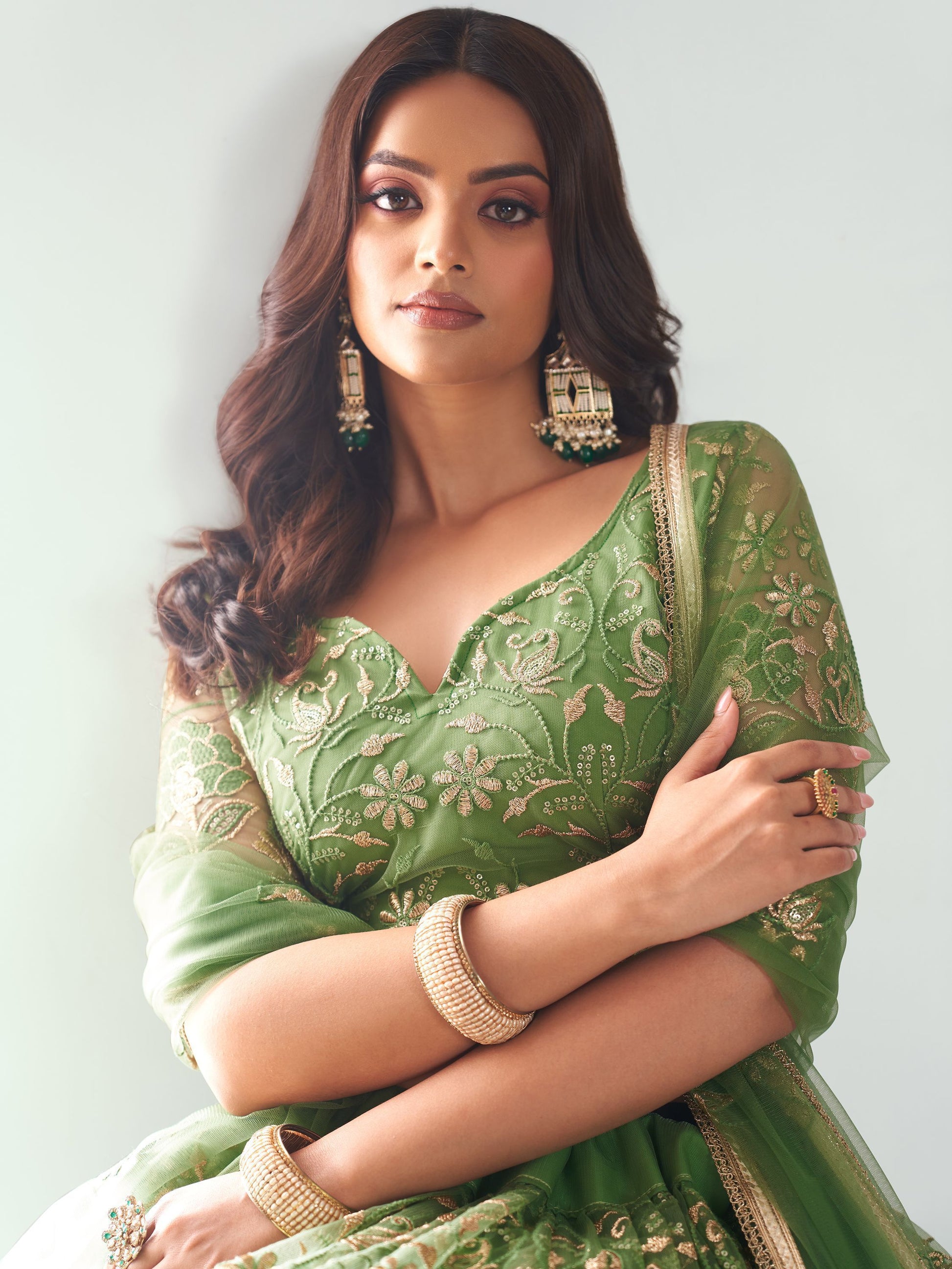 Elegant Green Embroidered Net Mehendi Lehenga Choli