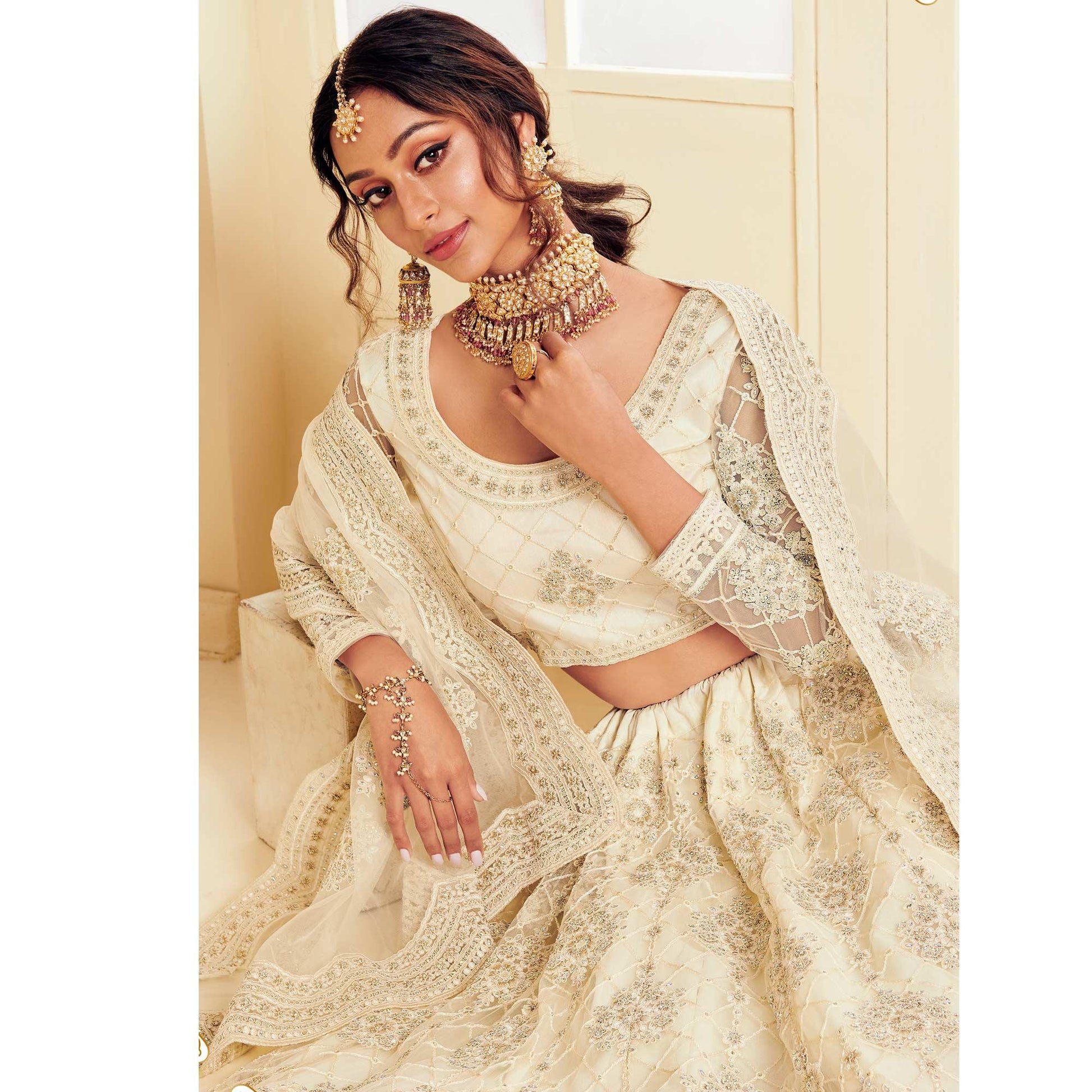 Elegant Off White Coloured Wedding Wear Cording Embroidered Net Lehenga Choli