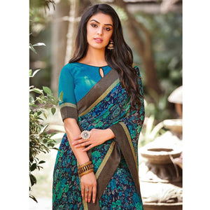Elegant Peacock Blue Colored Partywear Printed Georgette Saree