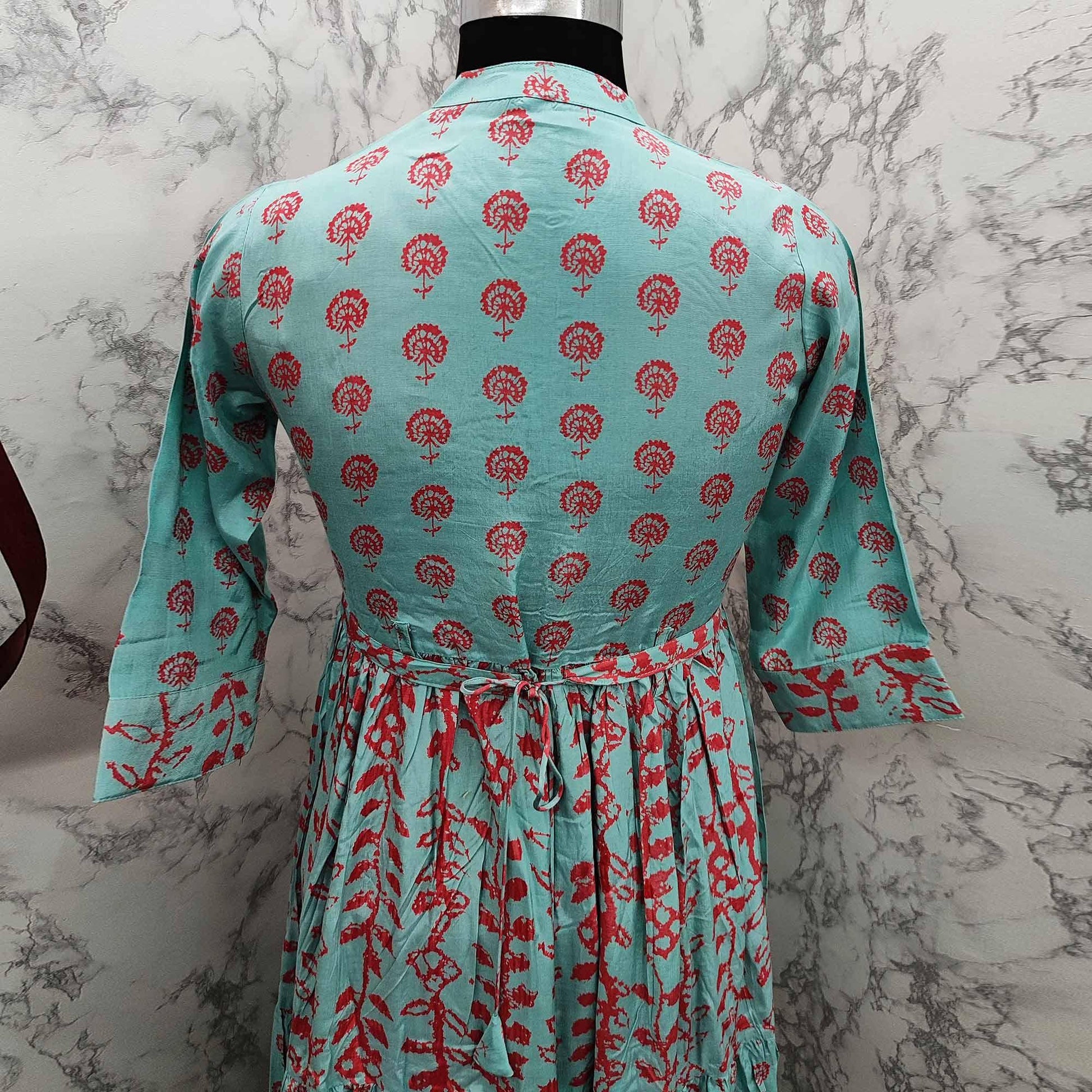 Elegant Turquoise Green Colored Partywear Printed Anarkali Style Cotton Silk Long Kurti