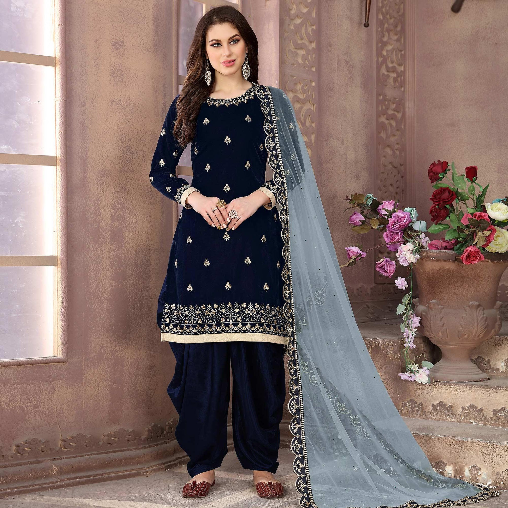 Energetic Navy Blue Colored Partywear Embroidered Velvet Patiala Suit