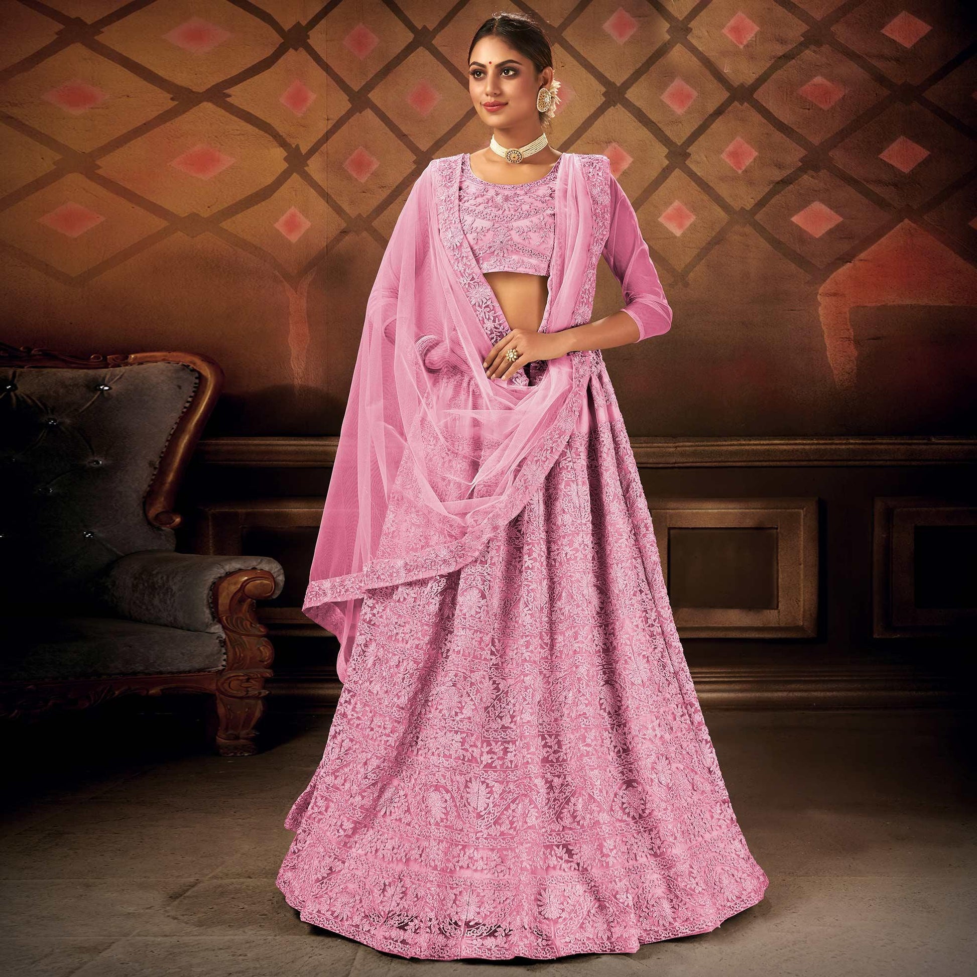 Energetic Pink Colored Partywear Embroidered Net Lehenga Choli
