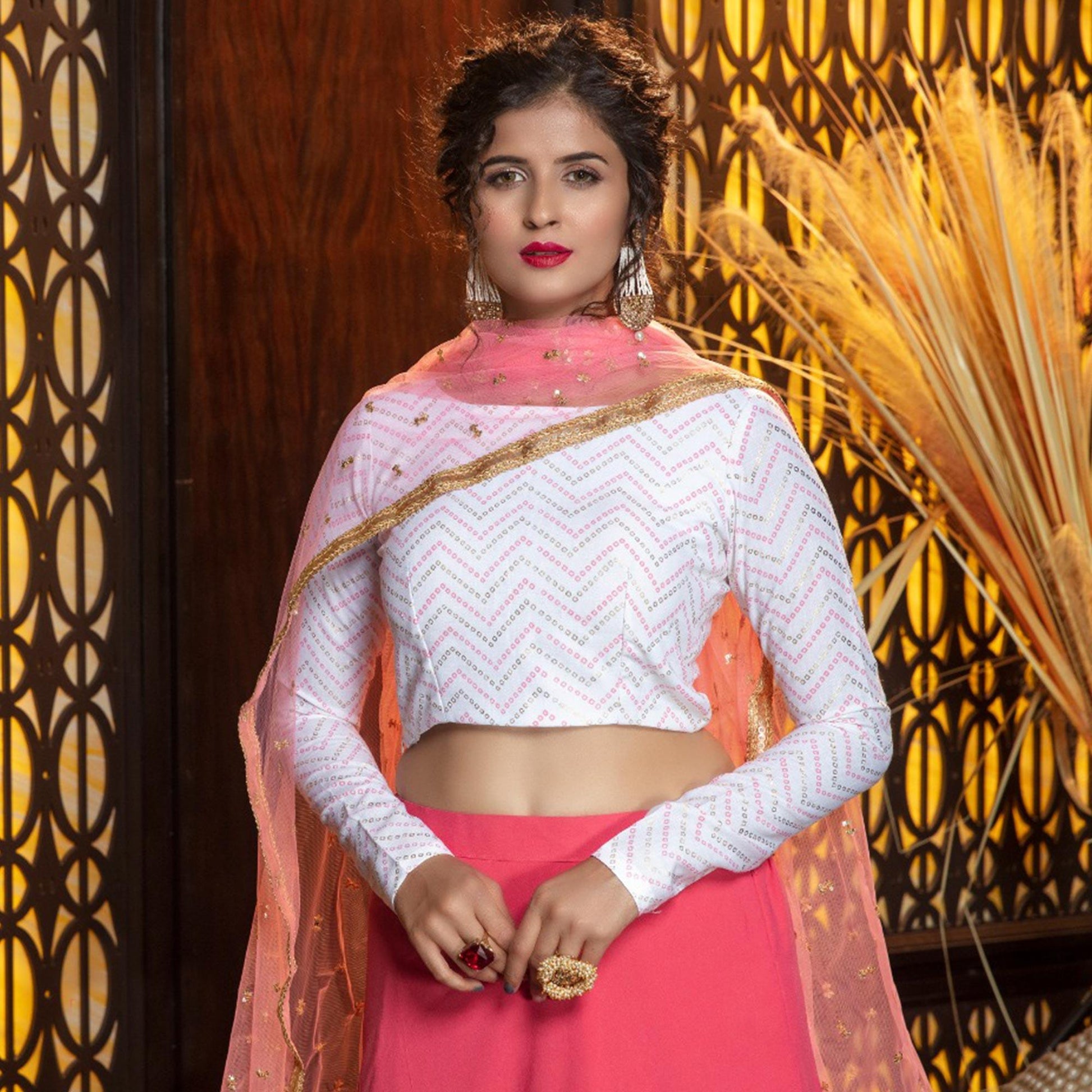Energetic Pink Colored Partywear Foil Printed Georgette Lehenga Choli
