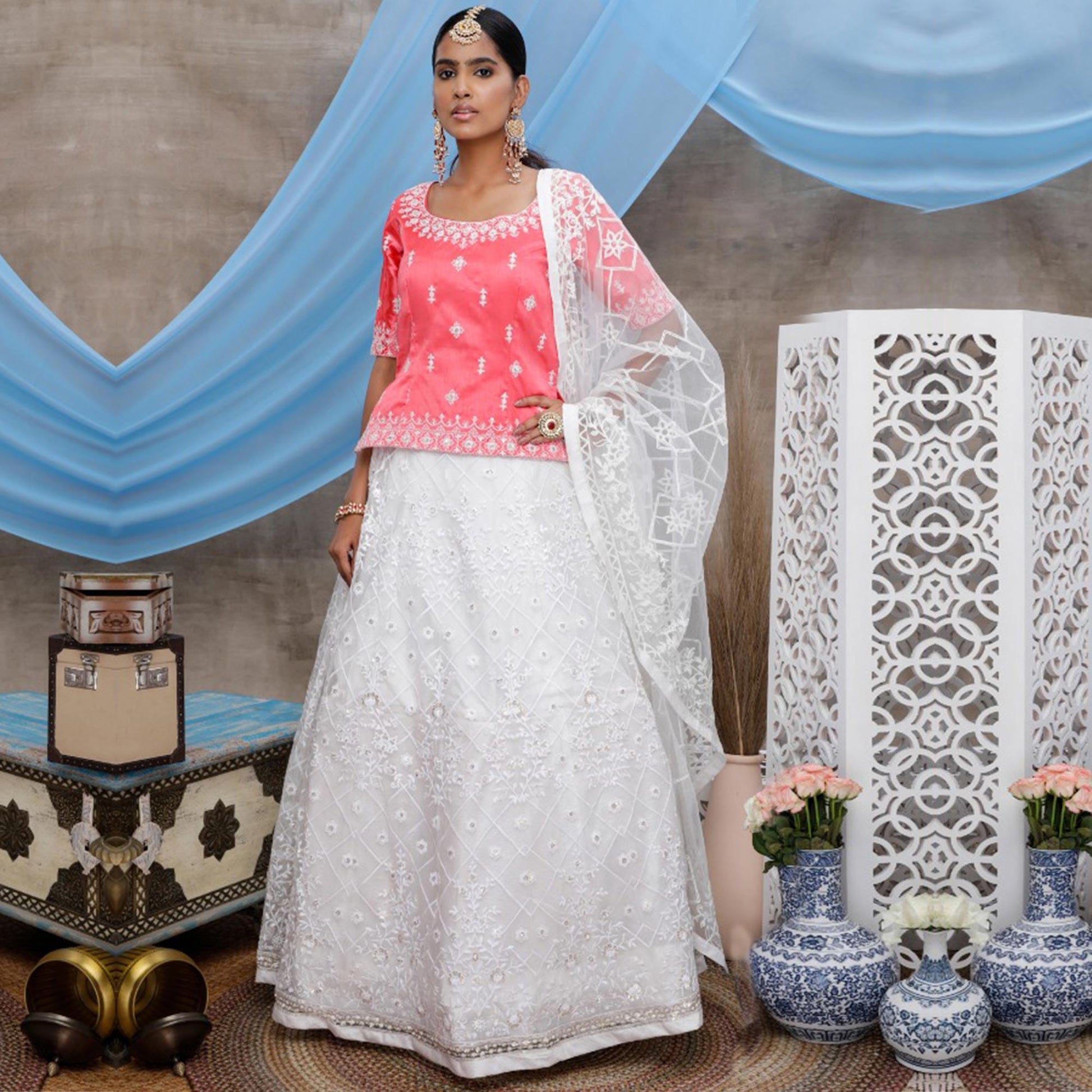 Energetic White-Pink Colored Party Wear Embroidered Net Lehenga Choli