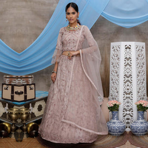 Engrossing Dusty Purple Colored Party Wear Heavy Embroidered Net Lehenga Choli