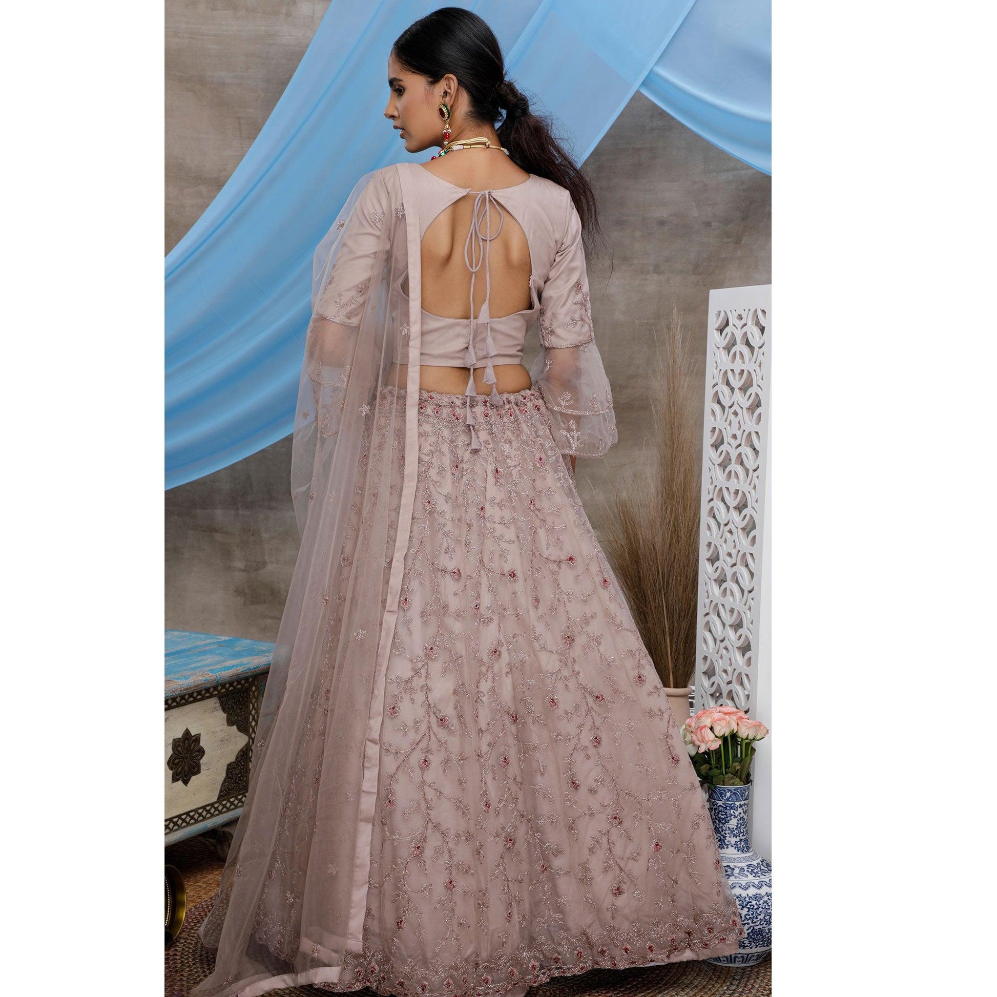 Engrossing Dusty Purple Colored Party Wear Heavy Embroidered Net Lehenga Choli