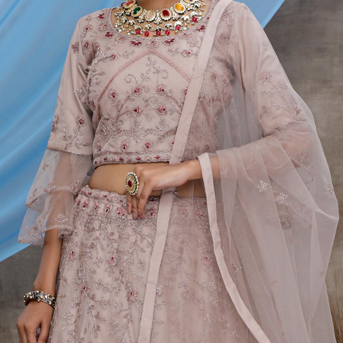 Engrossing Dusty Purple Colored Party Wear Heavy Embroidered Net Lehenga Choli