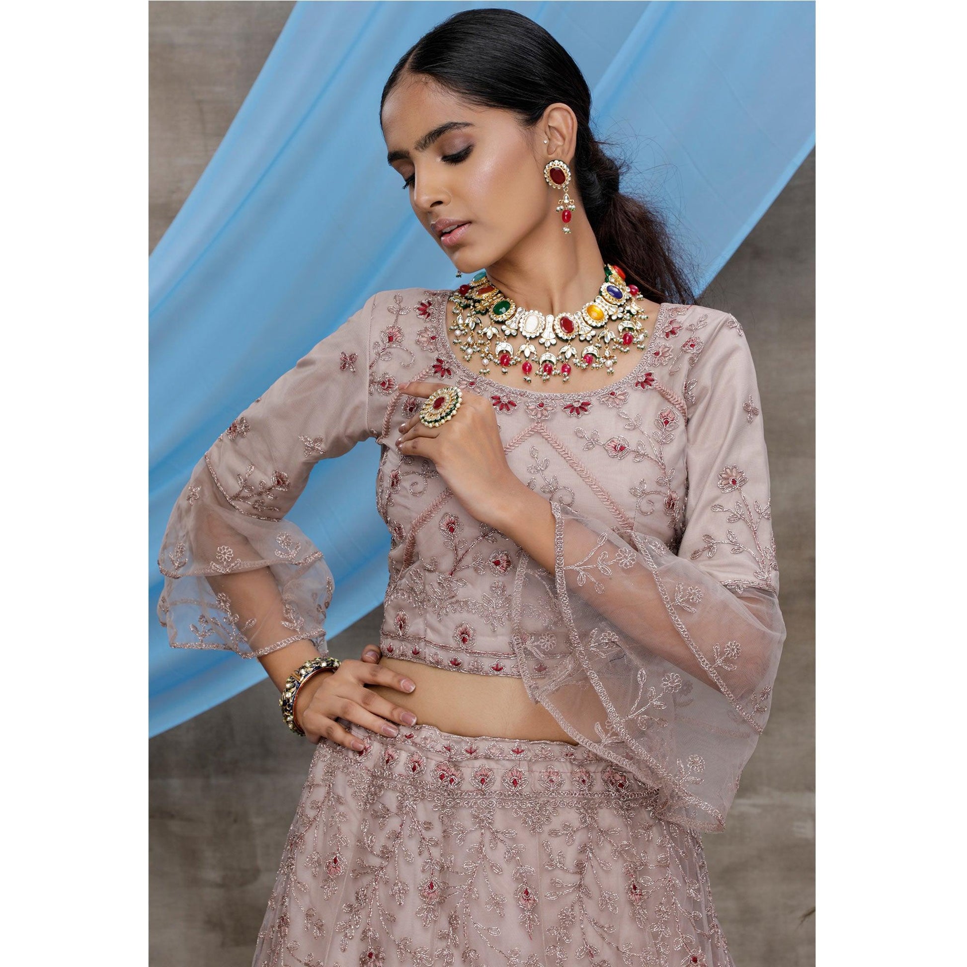 Engrossing Dusty Purple Colored Party Wear Heavy Embroidered Net Lehenga Choli