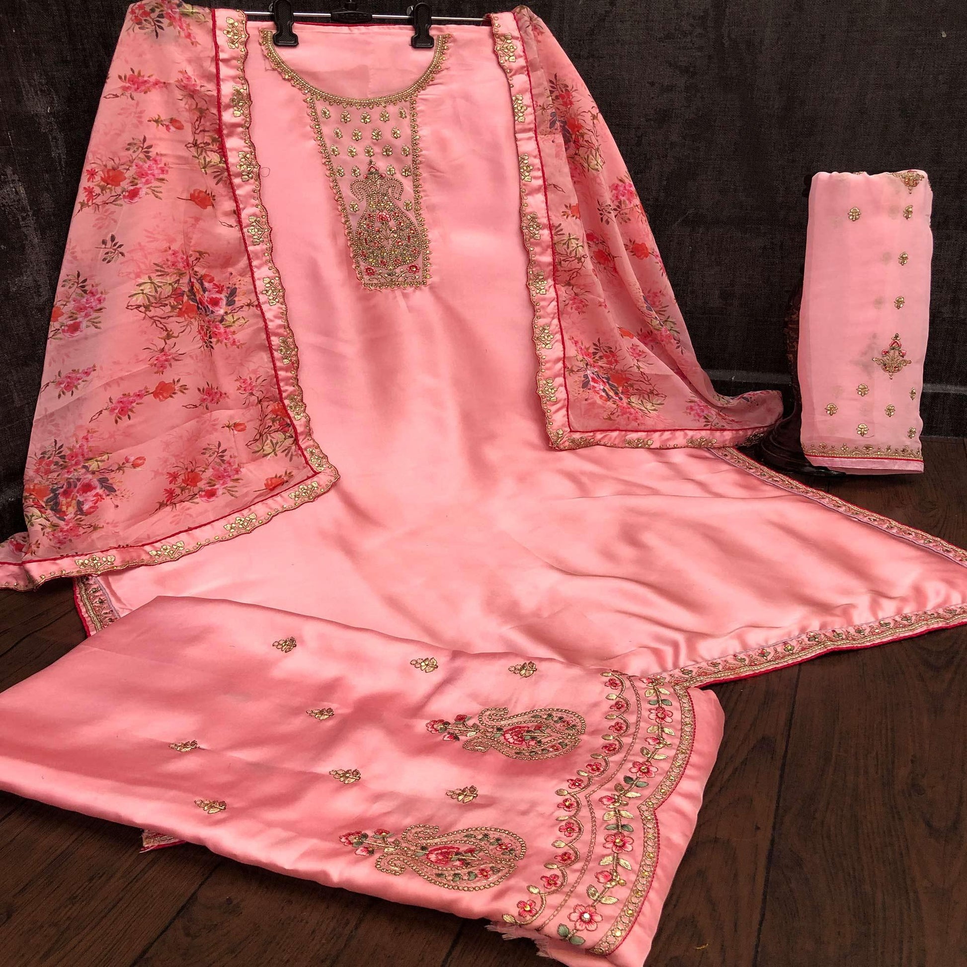 Engrossing Pink Colored Partywear Embroidered Muslin Satin Gharara Suit With Palazzo