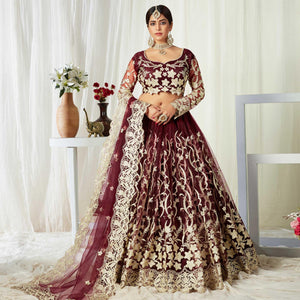 Entrancing Maroon Colored Wedding Wear Butterfly Net With Embroidered Lehenga Choli