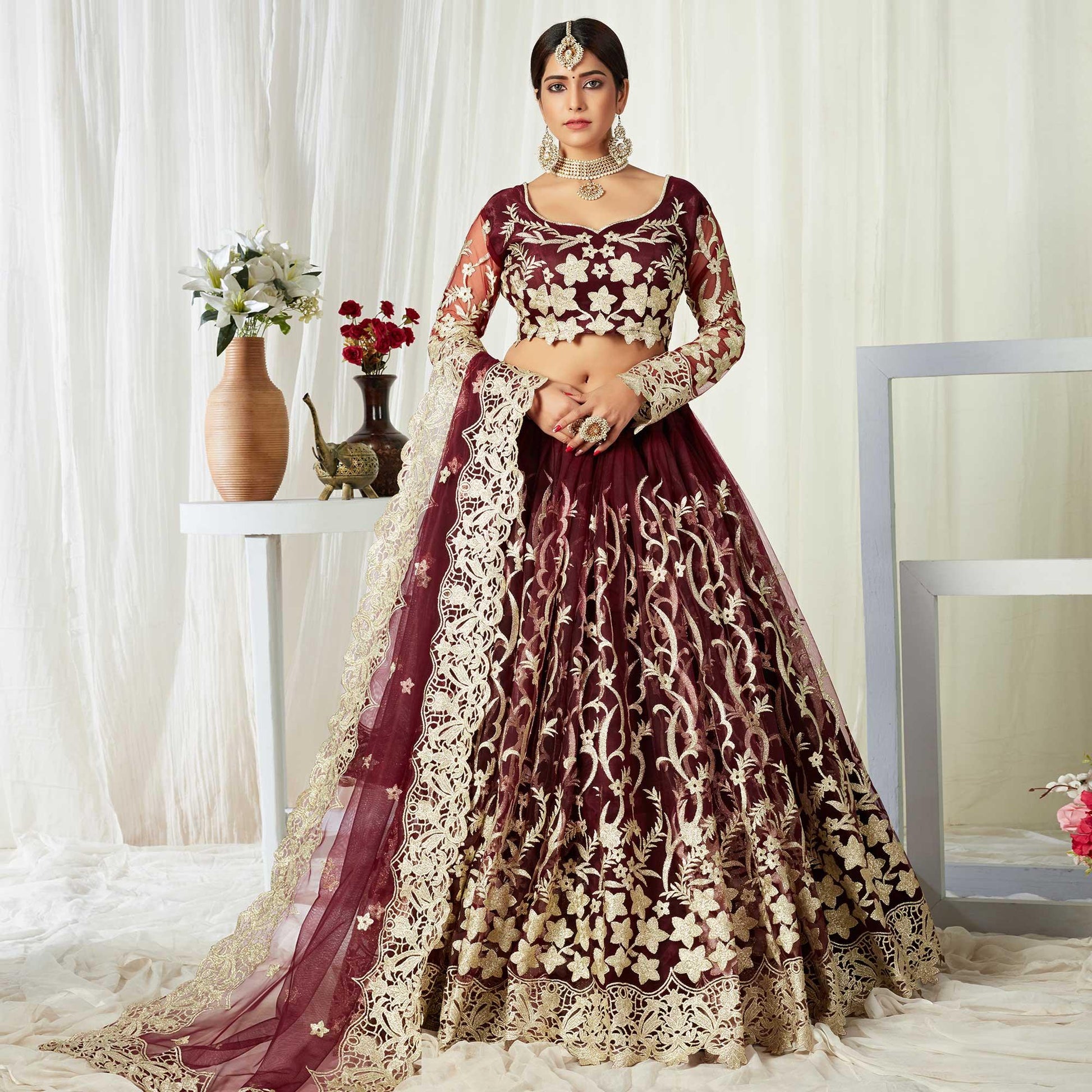 Entrancing Maroon Colored Wedding Wear Butterfly Net With Embroidered Lehenga Choli
