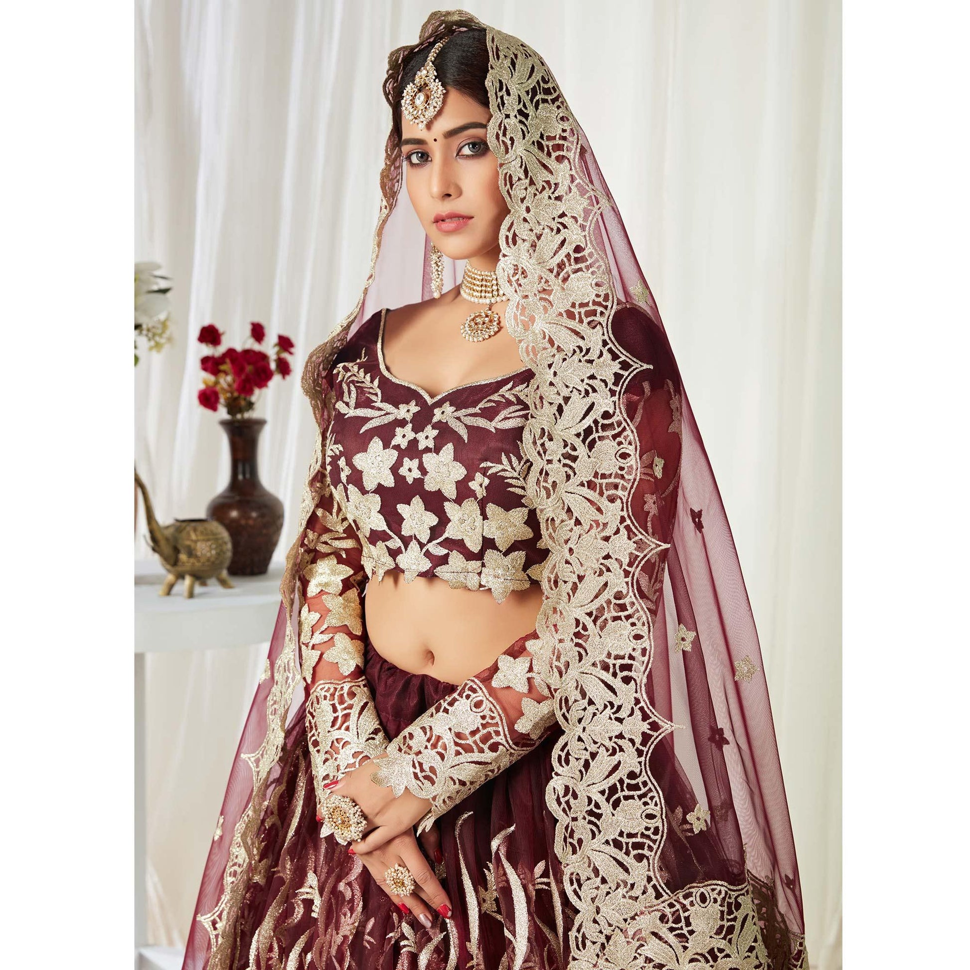 Entrancing Maroon Colored Wedding Wear Butterfly Net With Embroidered Lehenga Choli