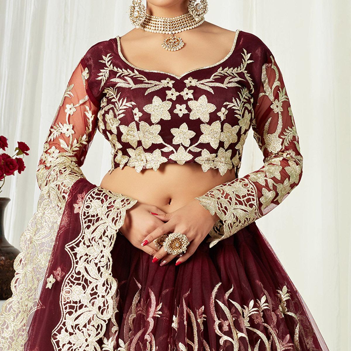 Entrancing Maroon Colored Wedding Wear Butterfly Net With Embroidered Lehenga Choli