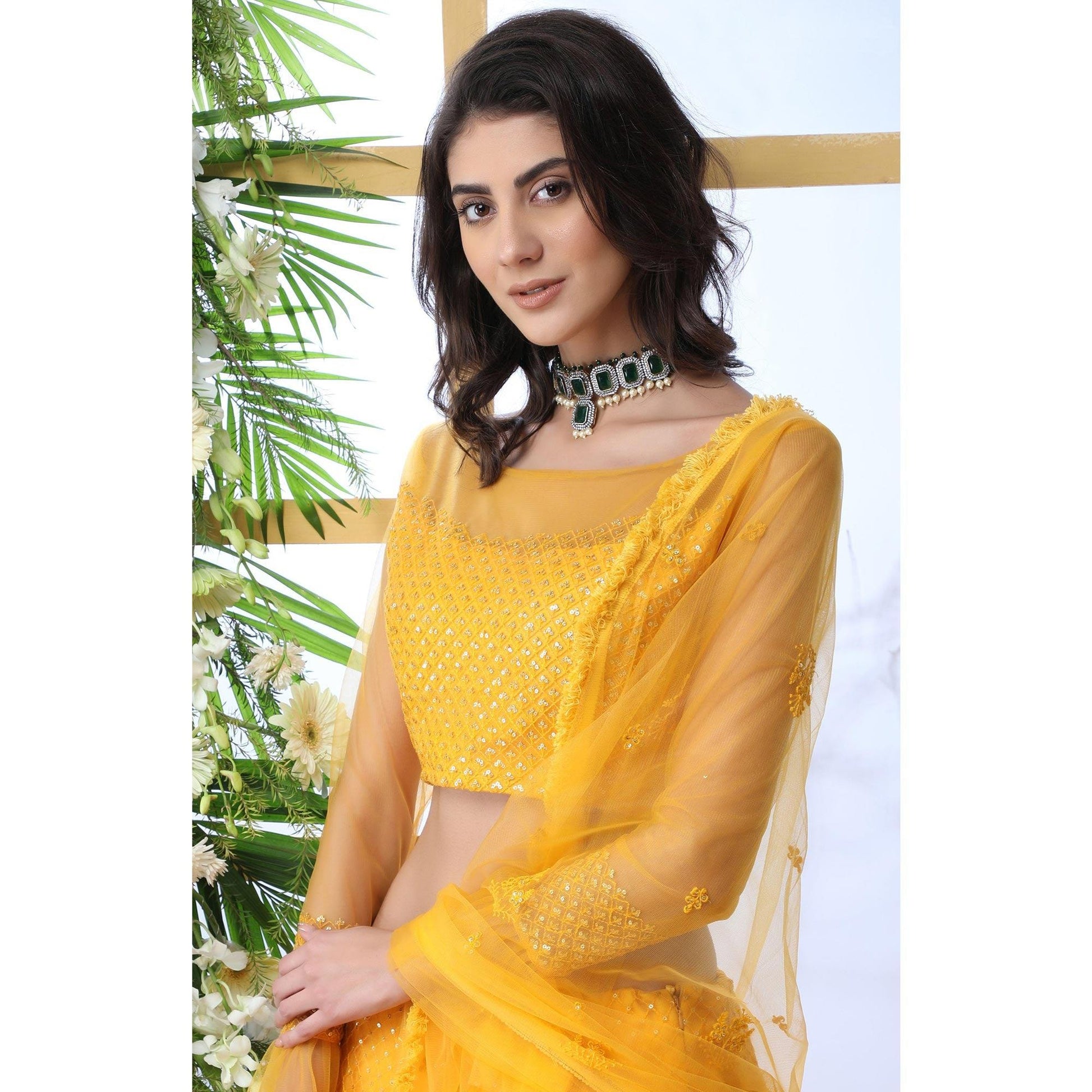Entrancing Mustard Yellow Colored Partywear Embroidered Netted Lehenga Choli