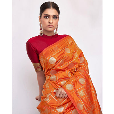 Entrancing Orange Colored Festive Wear Woven Silk Saree